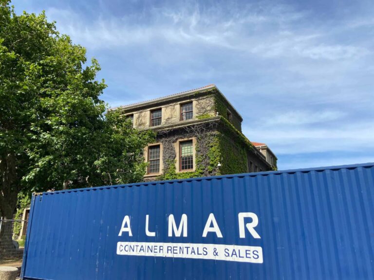 Interior of a clean, empty Almar shipping container showing intact door seals and weather-resistant Corten steel walls