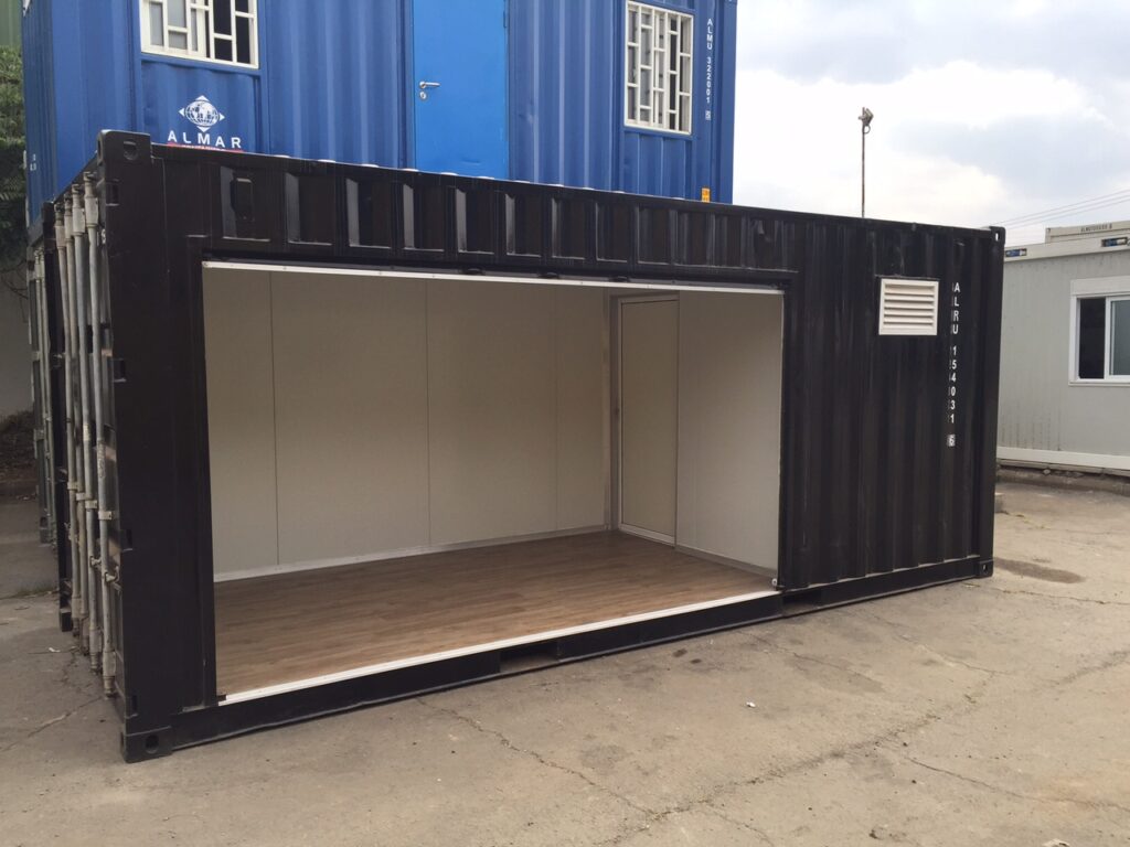 A custom-fabricated Almar shipping container converted into a vibrant, branded retail farm stall selling fresh produce in Kenya.