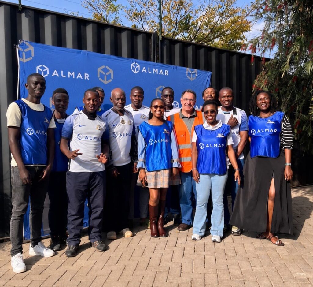 Blitz Soccer FC players with the Almar Kenya team at the Nairobi depot