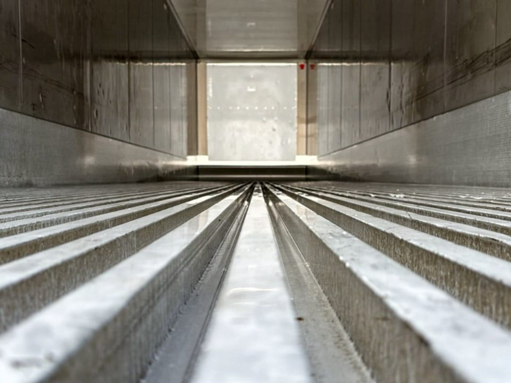 Aluminum T-bar flooring inside an Almar refrigerated container for optimized airflow.