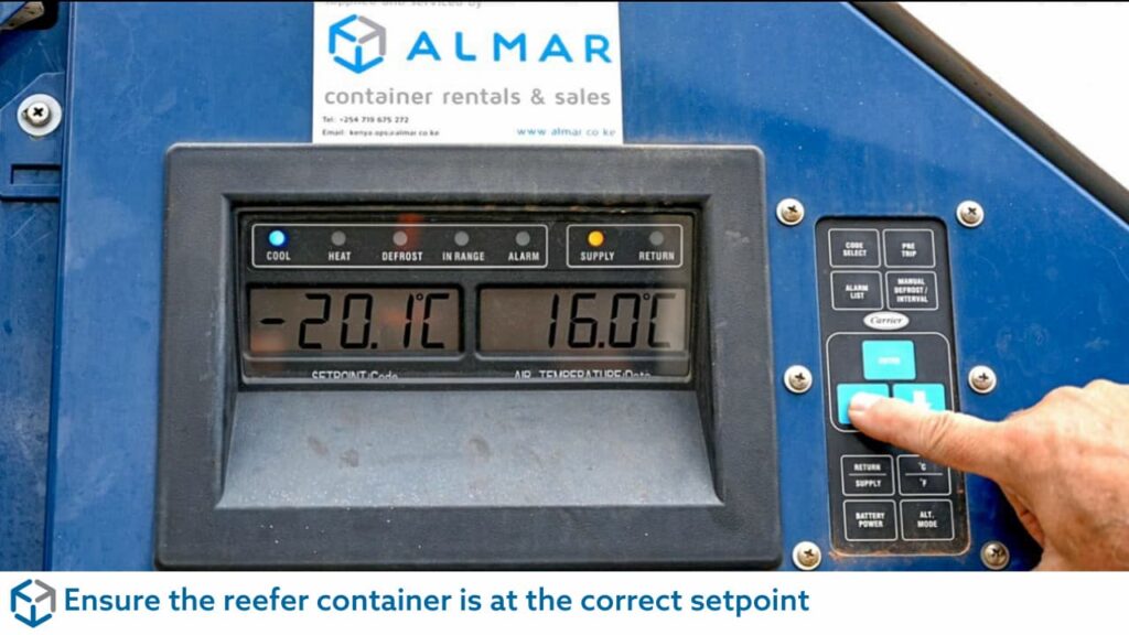 Hand adjusting the Almar Reefer container digital setpoint display for pre-cooling cargo temperature in South Africa