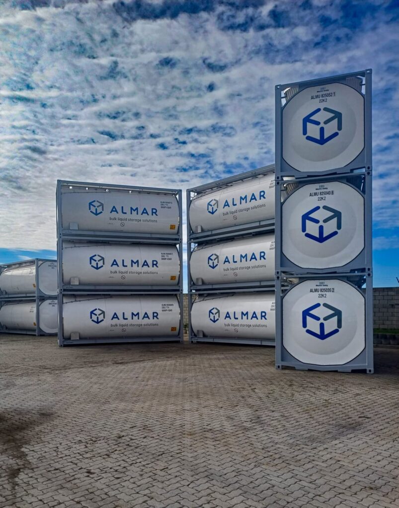 Stacked white T11 ISO tanks showing the end-cap design for bulk liquid storage by Almar Container Group.